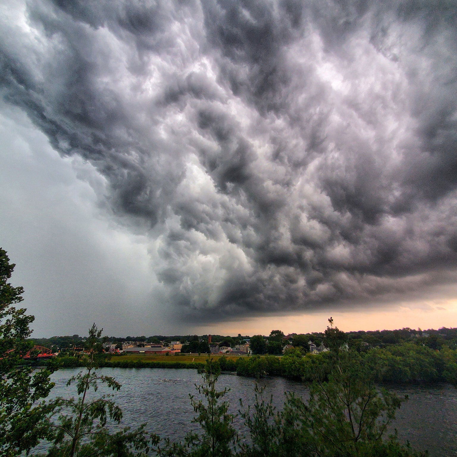 An oncoming storm in Lowell, MA by Edward